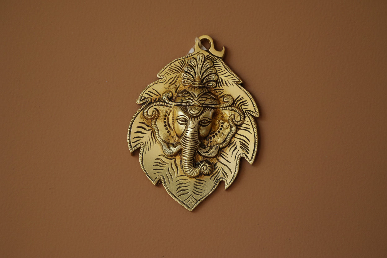 Brass Ganesha Face on Leaf Wall Hanging – Auspicious Home Décor, Spiritual Gift & Positive Energy Symbol