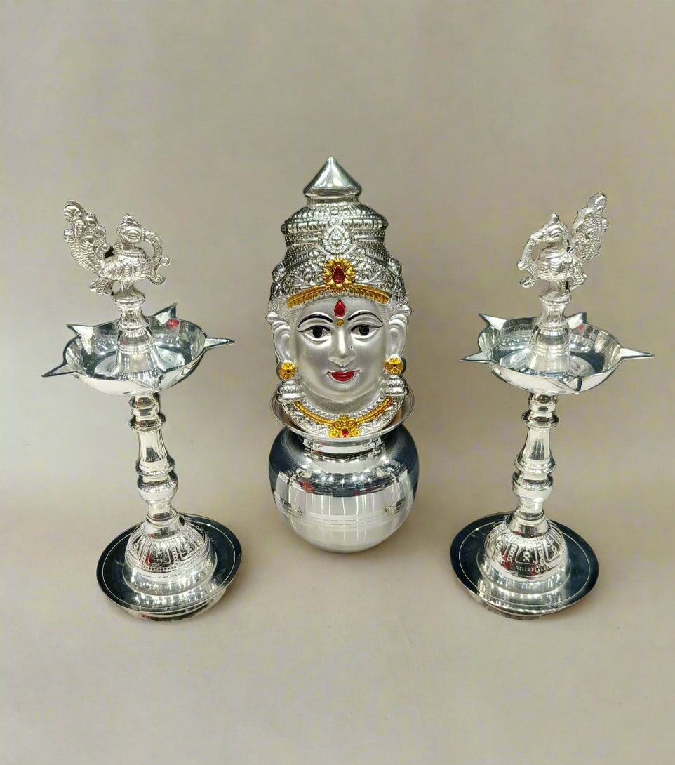 silver plated peacock diya with kalash and lakshmi face