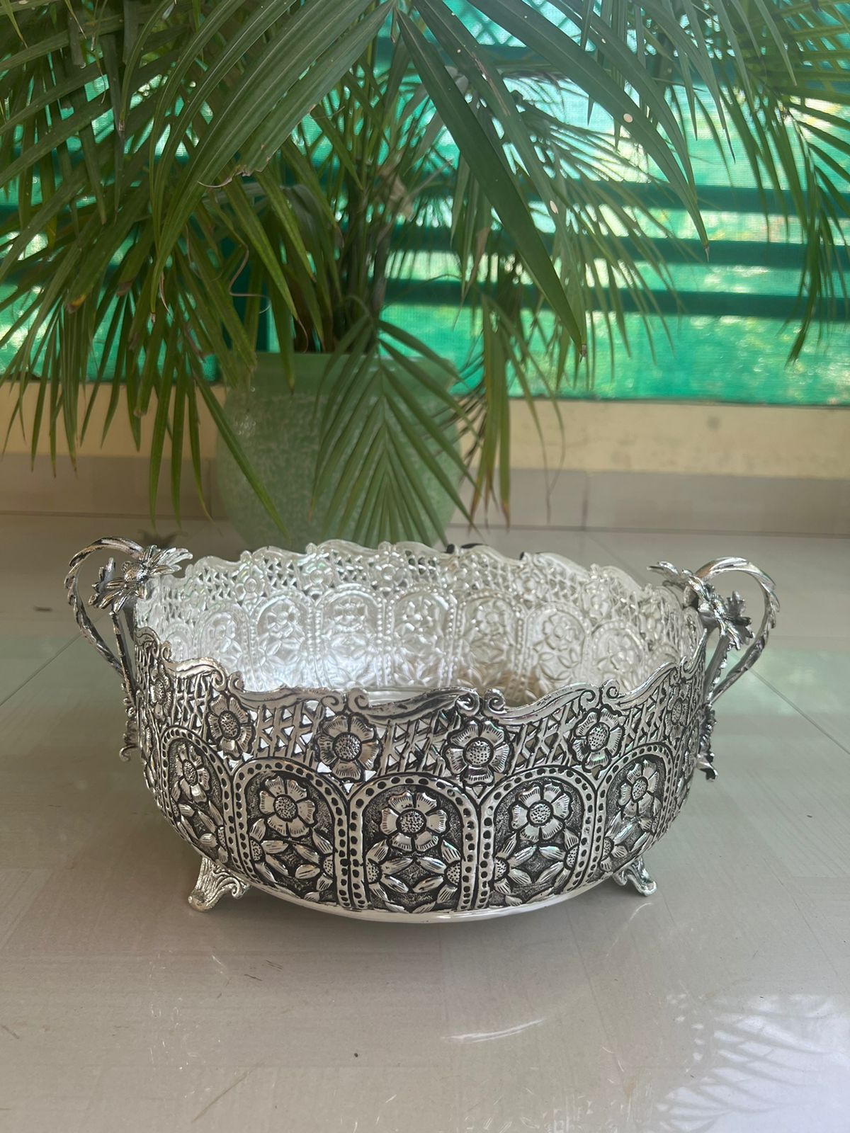 german silver fully carved round designer urli/basket with flower handles for home décor/gift item