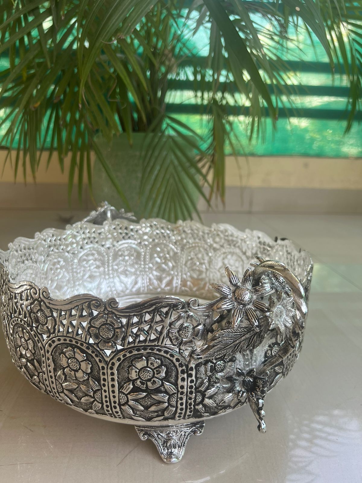 German silver fully carved round designer urli/basket with flower handles