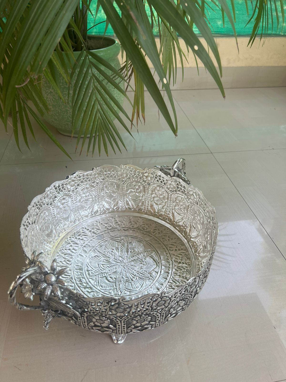German silver fully carved round designer urli/basket with flower handles