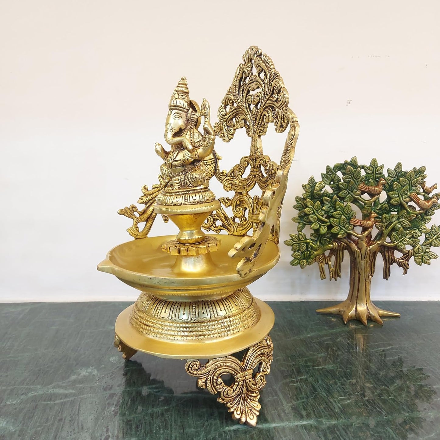 brass Ganesh urli bowl with 2 side peacock décor