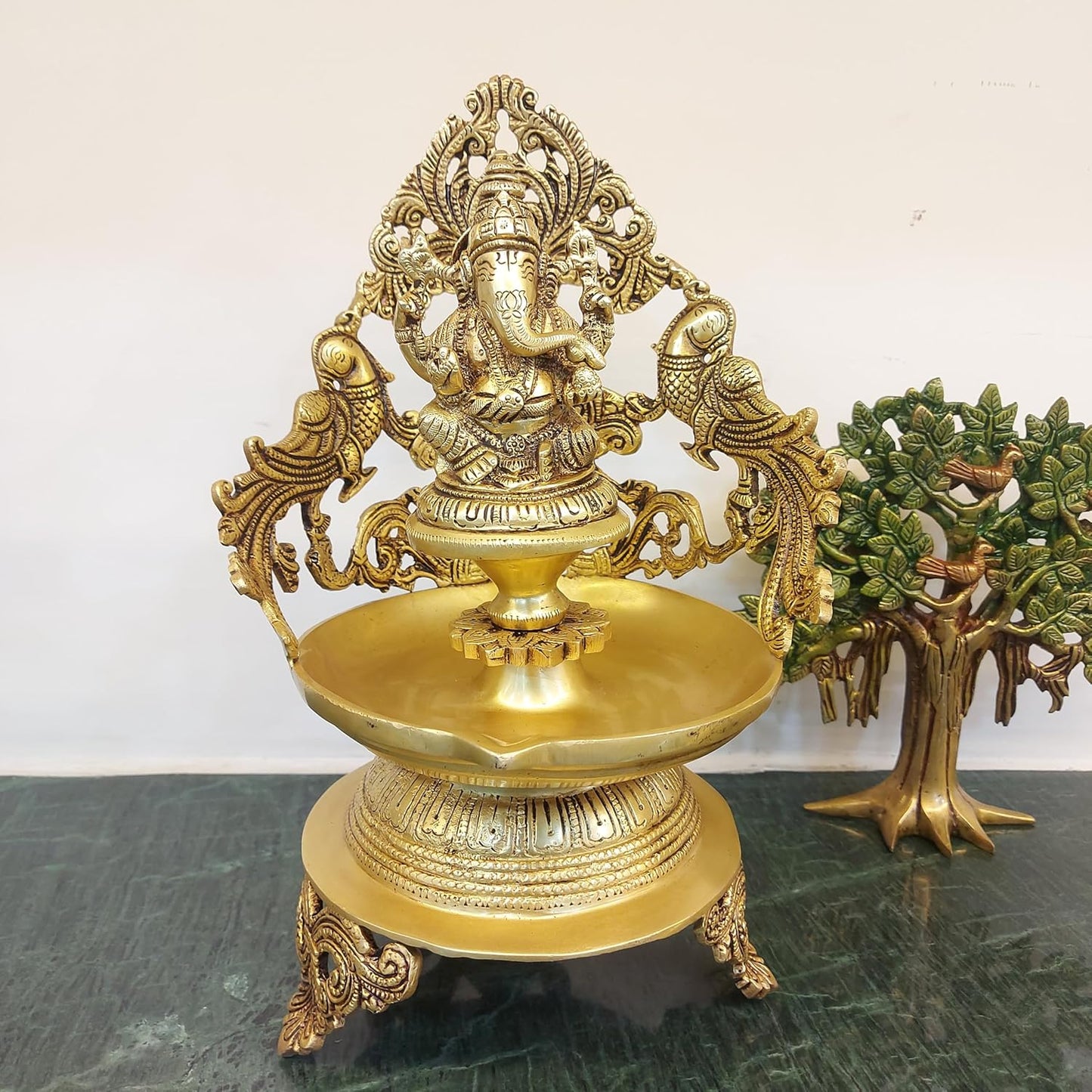 brass Ganesh urli bowl with 2 side peacock décor