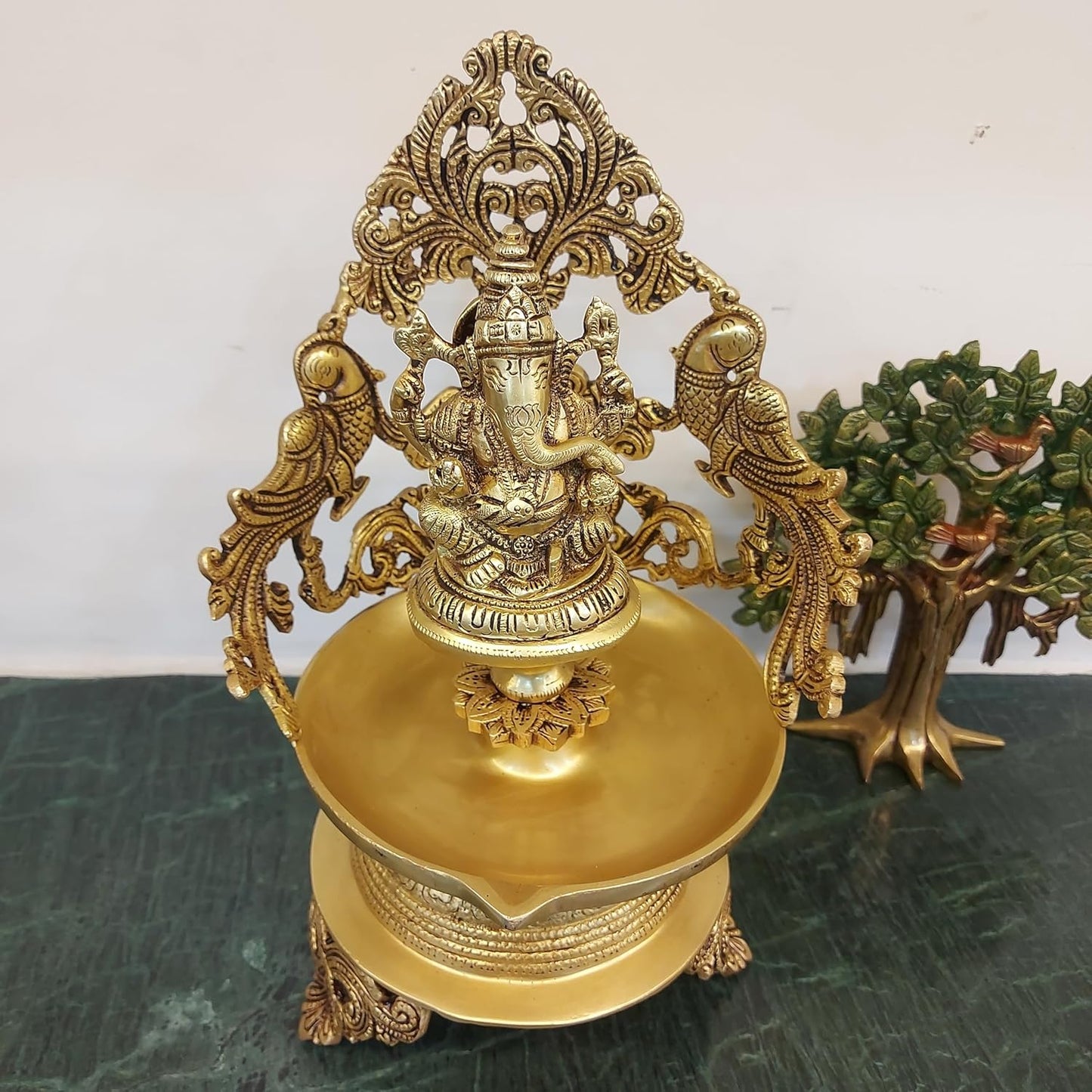 brass Ganesh urli bowl with 2 side peacock décor