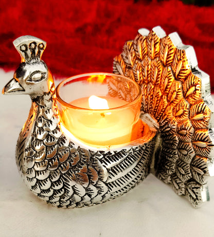 Antique finish German silver peacock pair with glass candle holder