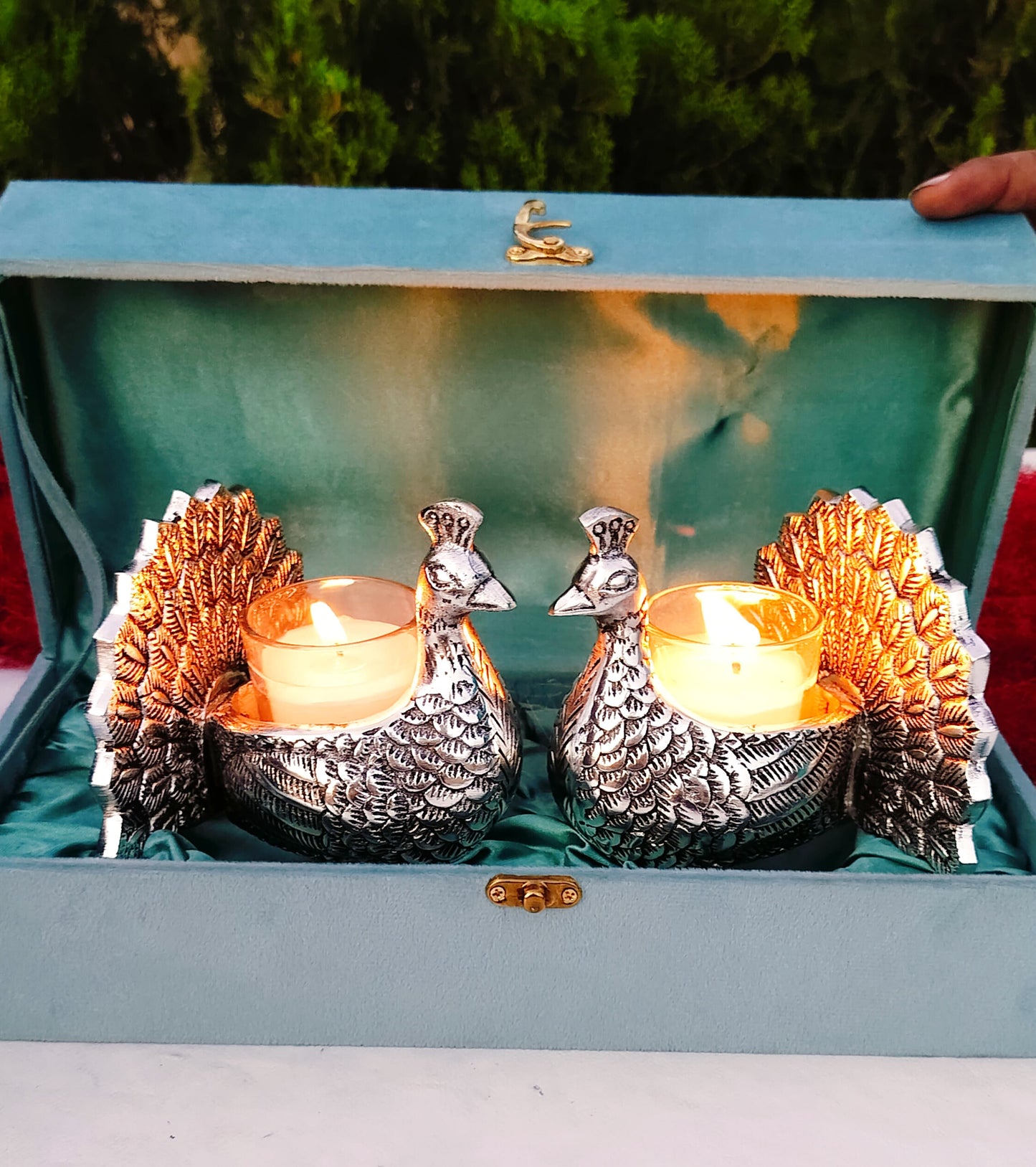 Antique finish German silver peacock pair with glass candle holder