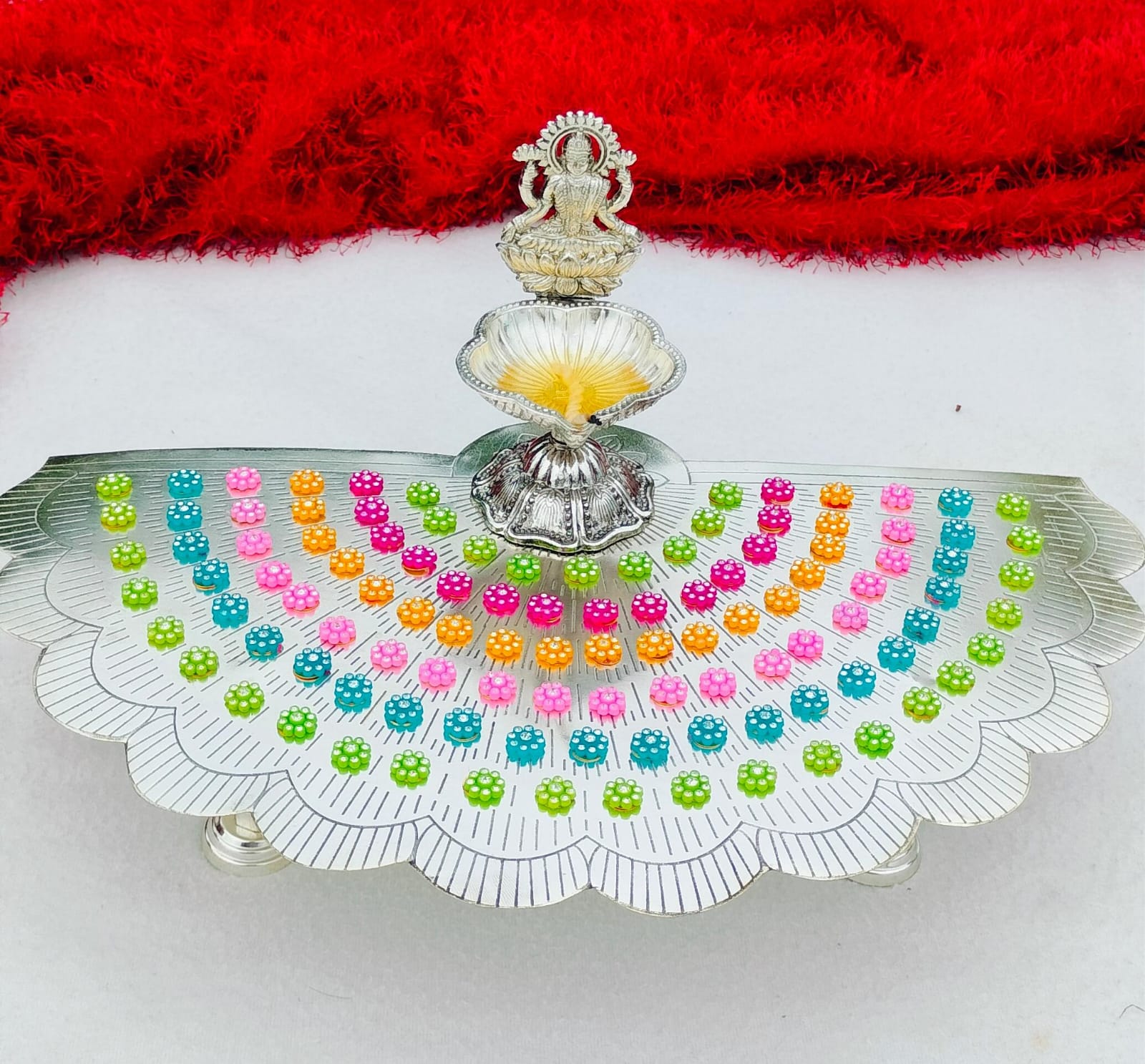 German silver flower stand with colorful flowers with lakshmi diya