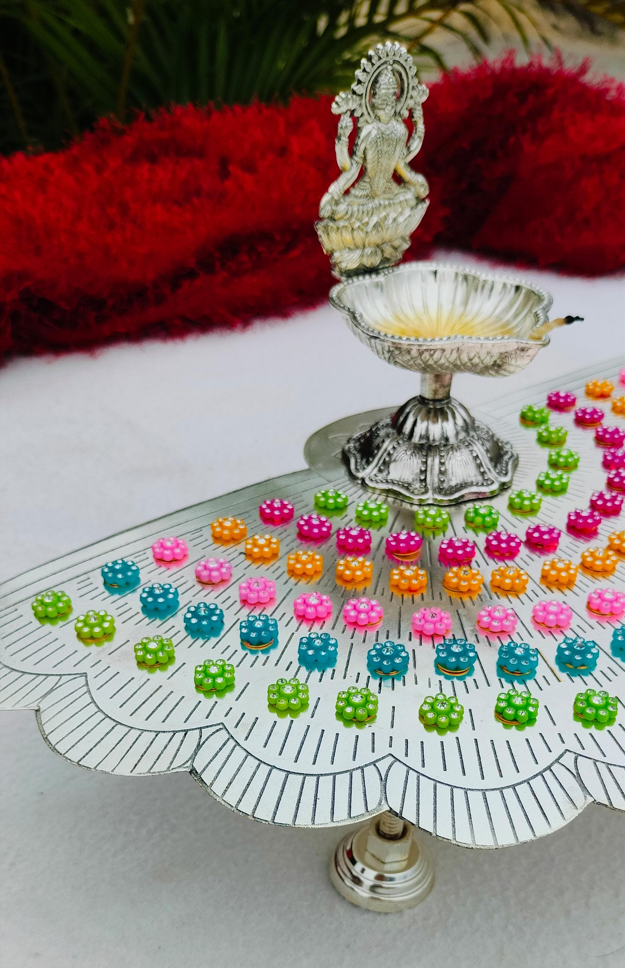 German silver flower stand with colorful flowers with lakshmi diya