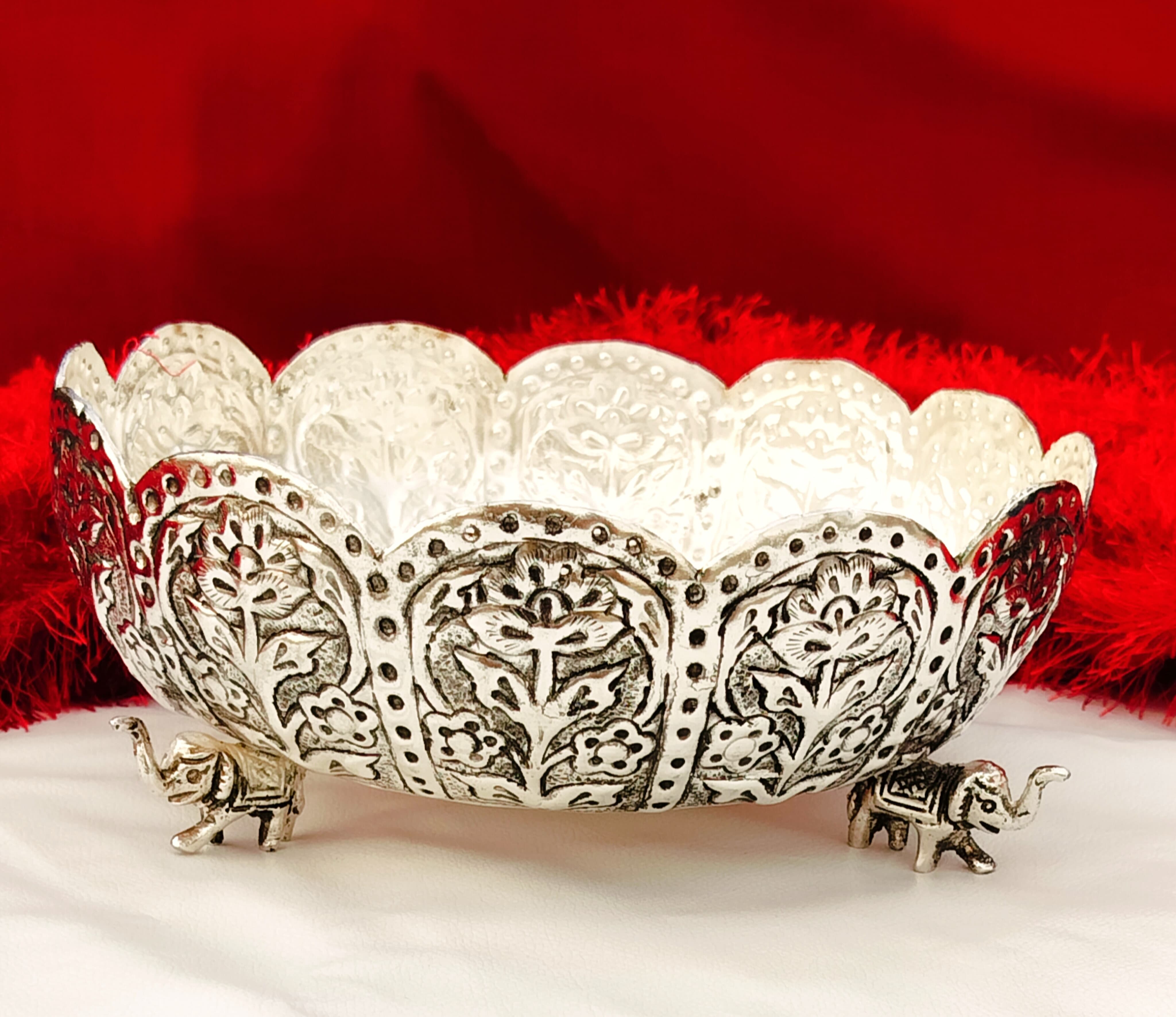 german silver fully carved urli bowl with 3 elephant legs