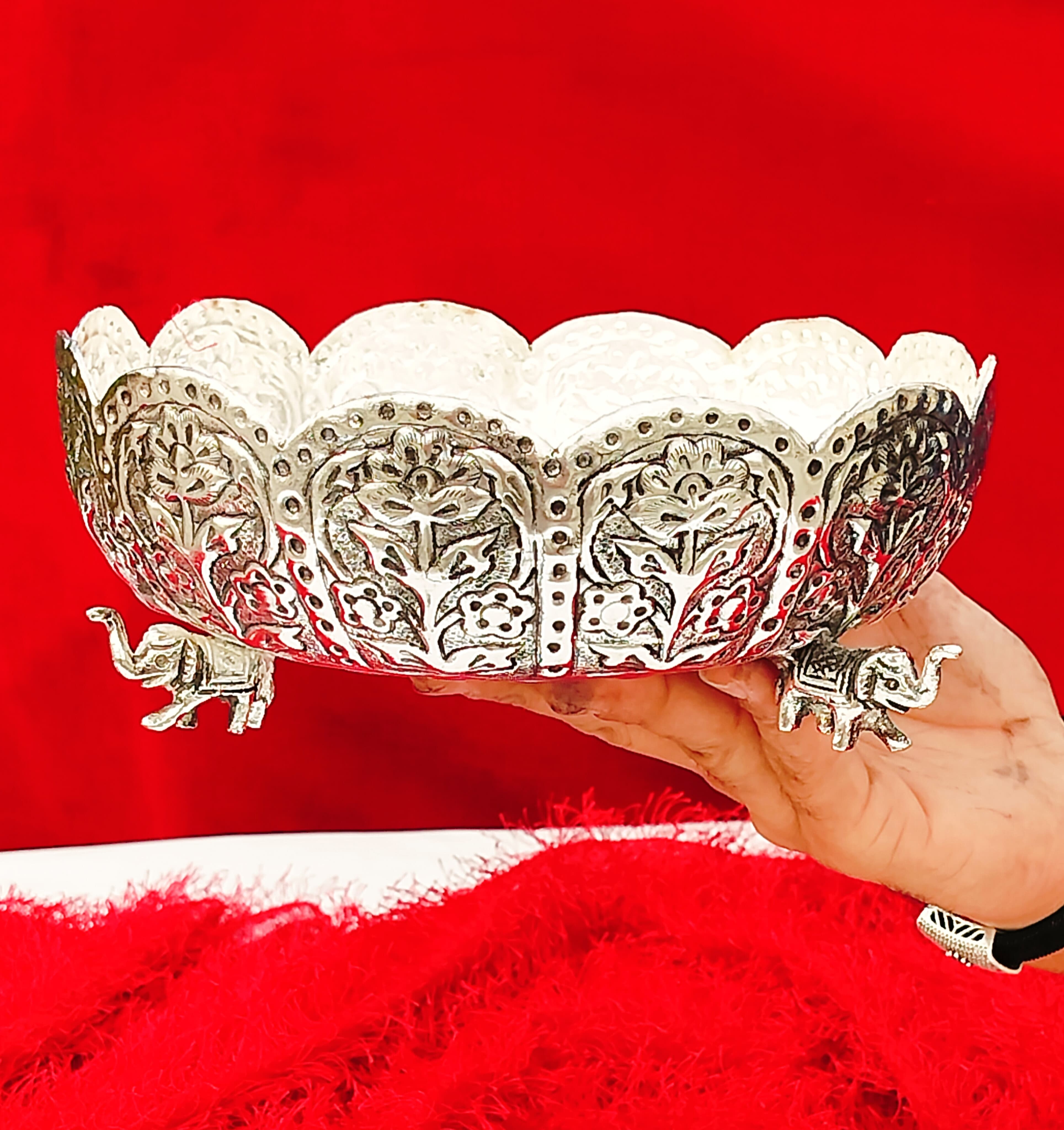 german silver fully carved urli bowl with 3 elephant legs