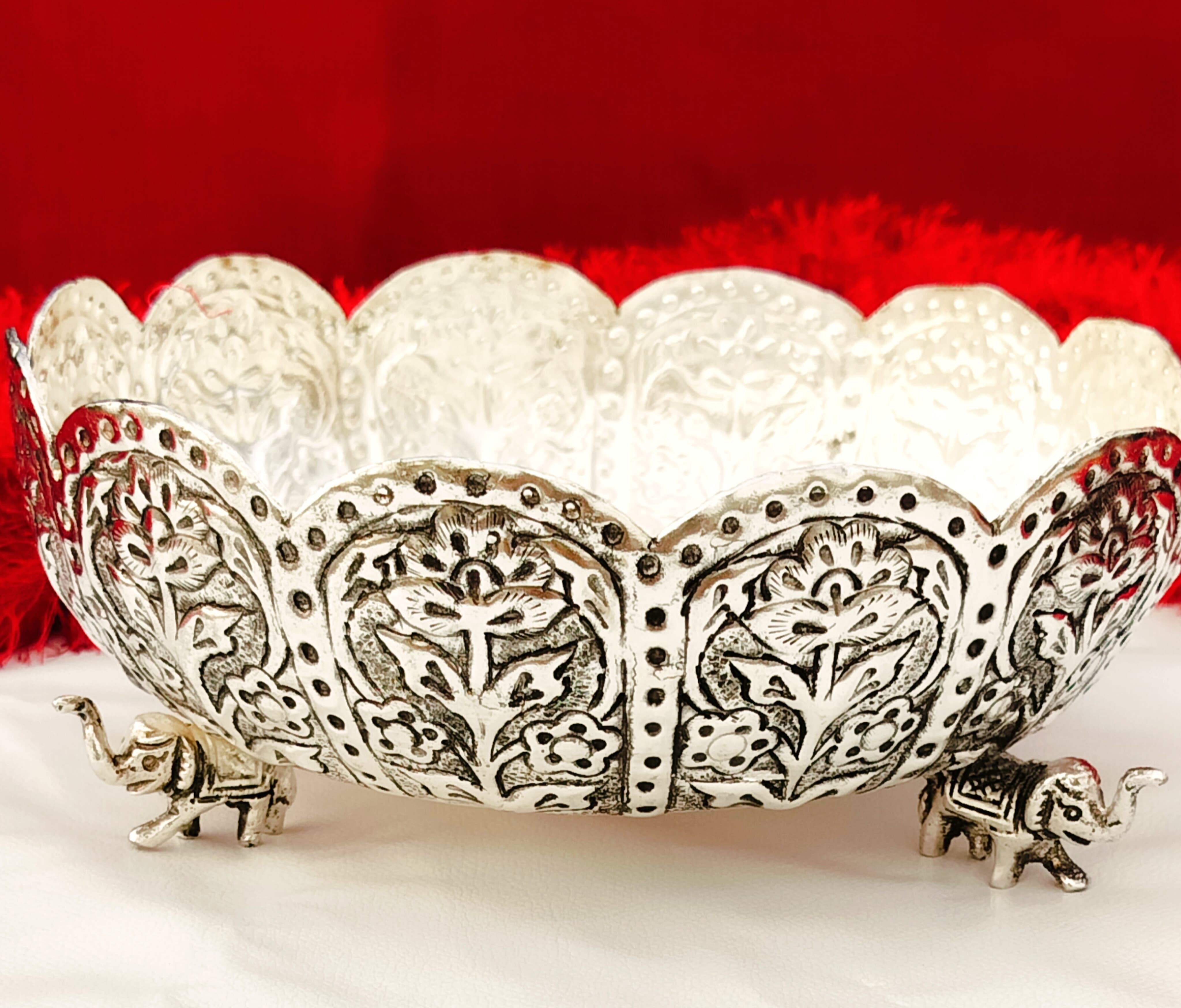 german silver fully carved urli bowl with 3 elephant legs