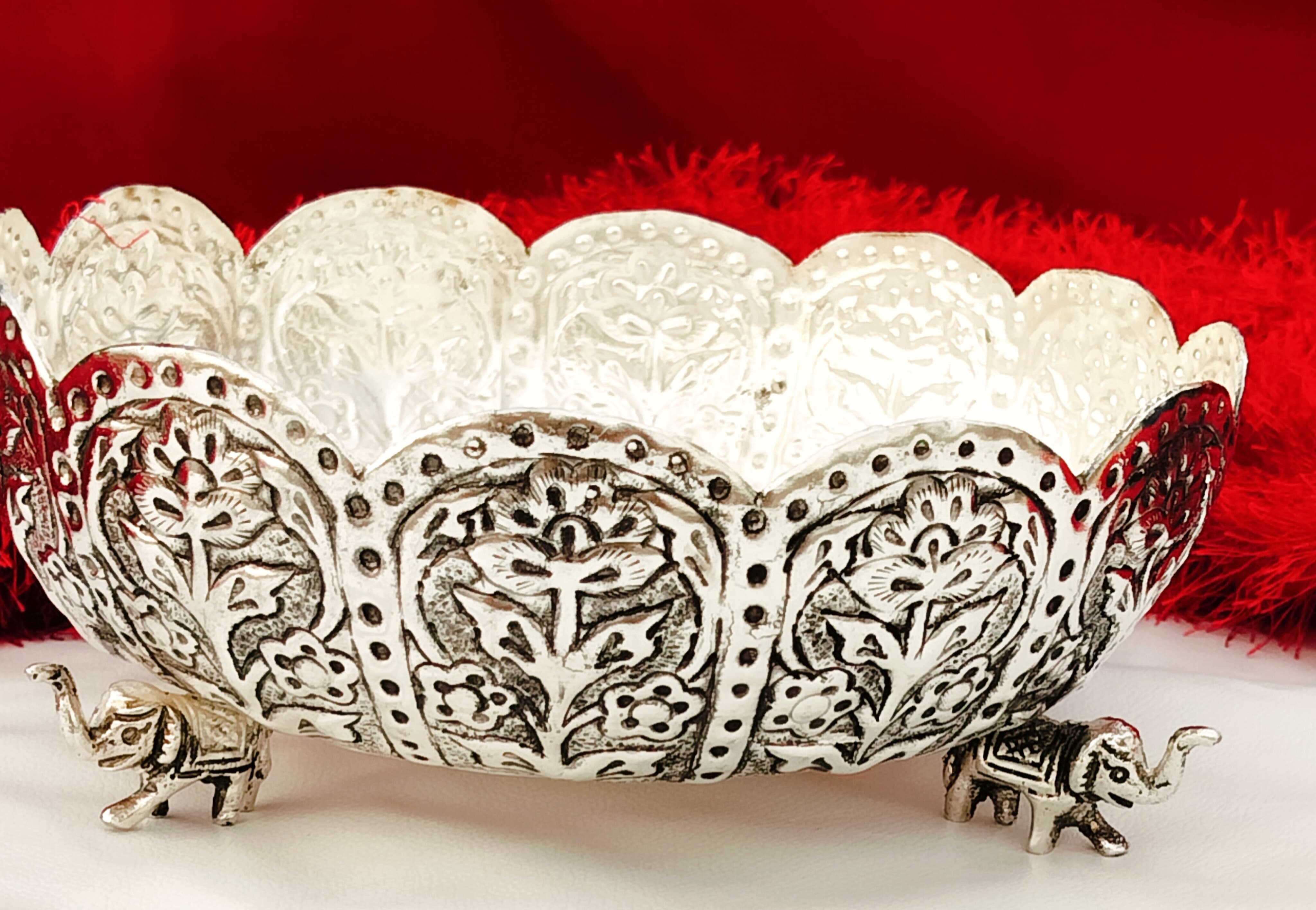 german silver fully carved urli bowl with 3 elephant legs
