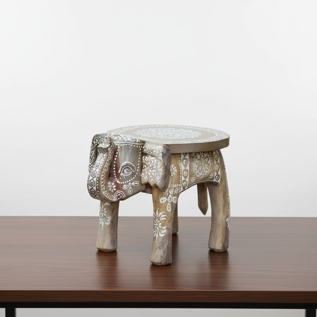 Artisan-crafted off-white wooden elephant stool with colorful painted accents, suitable for plant stands, side décor, and collectible displays.