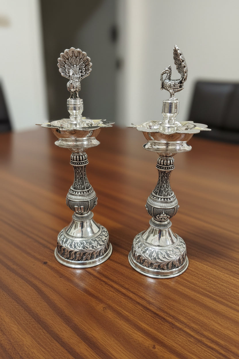 Pure Silver Plated Dancing Peacock diya with Shanku Design – Graceful Housewarming Gift & Elegant Home Décor Idol