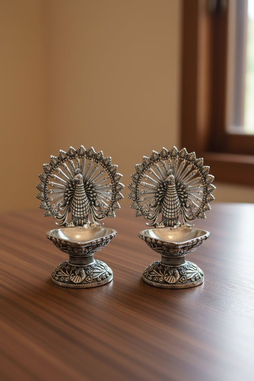 Pure Silver Plated German Silver Dancing Peacock Diya Pair – Elegant Antique Finish Lamps for Housewarming Pooja & Festive Décor