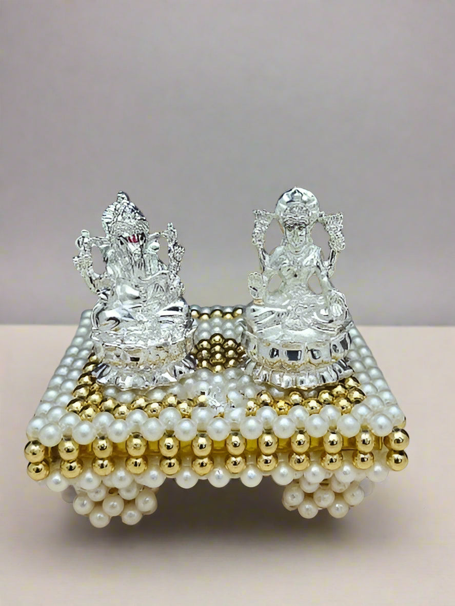 silver lakshmi Ganesh idol with stool