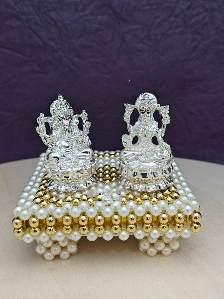 silver lakshmi Ganesh idol with stool