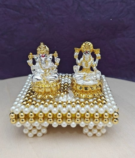golden and silver resin lakshmi Ganesh idol with stool