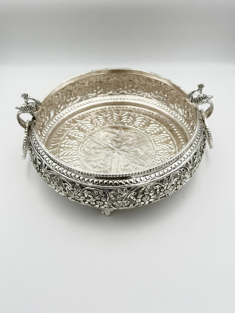 Traditional German silver peacock urli bowl with carved antique design, elegant festive décor accent for floating flowers, candles, and cultural celebrations.