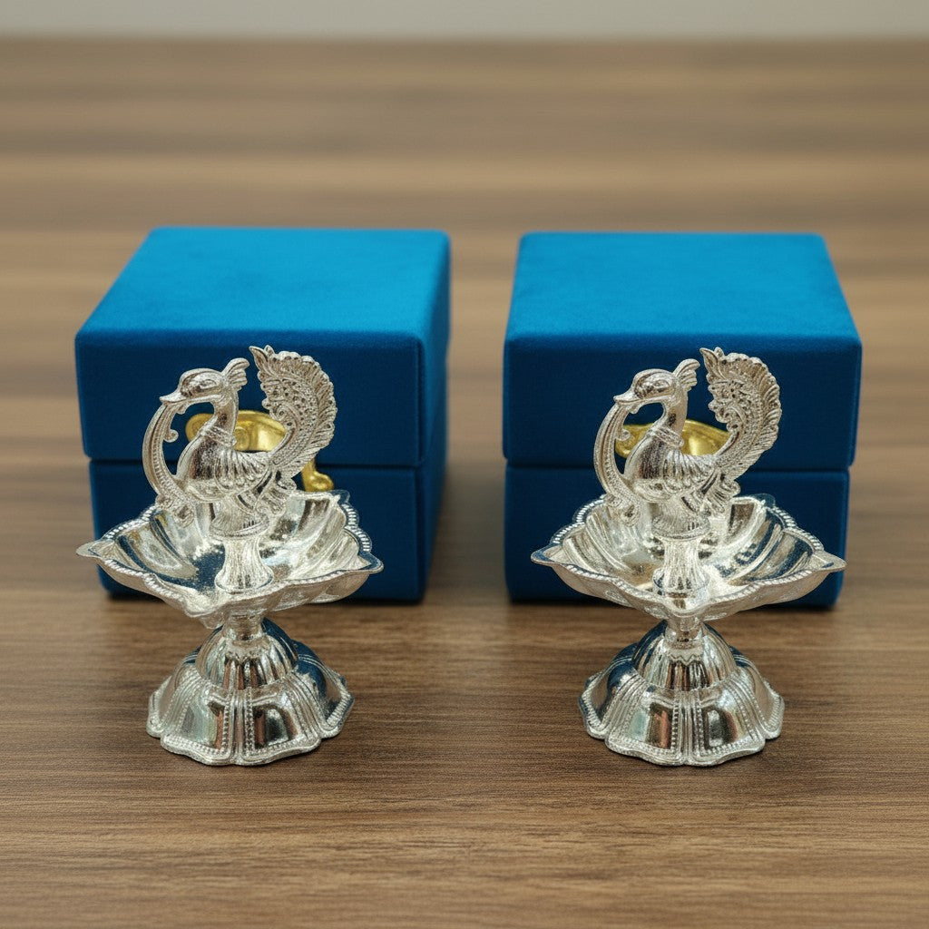 German silver peacock diya set of 2 with velvet gift box for festive décor and gifting.