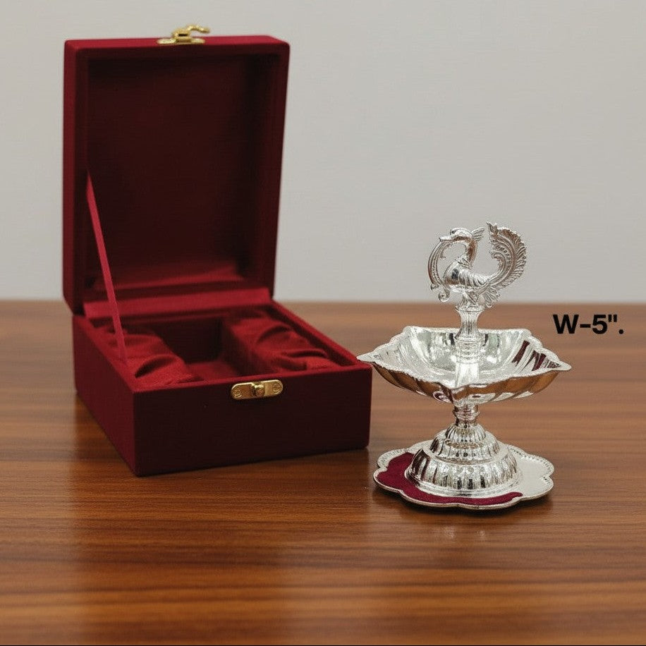 Premium set of German silver peacock diya samai featuring detailed craftsmanship, ideal for Diwali, pooja rituals, home temple decoration, and festive gifting.