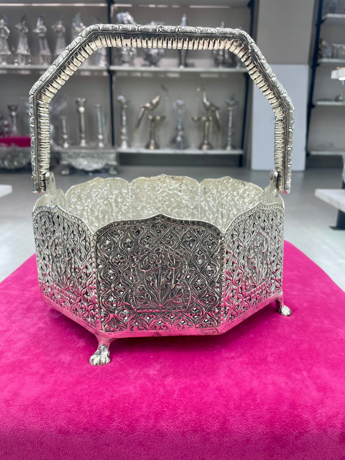 "Handcrafted German silver basket with intricate carvings and sturdy handle, perfect for pooja, festive décor, serving prasadam, fruits, or sweets, ideal as a gift item."