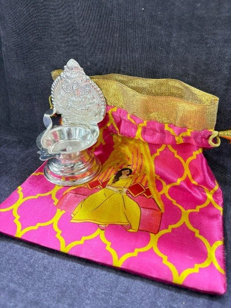 german silver 2 kamakshi / lakshmi diya set with 2 potli for home/ gift item