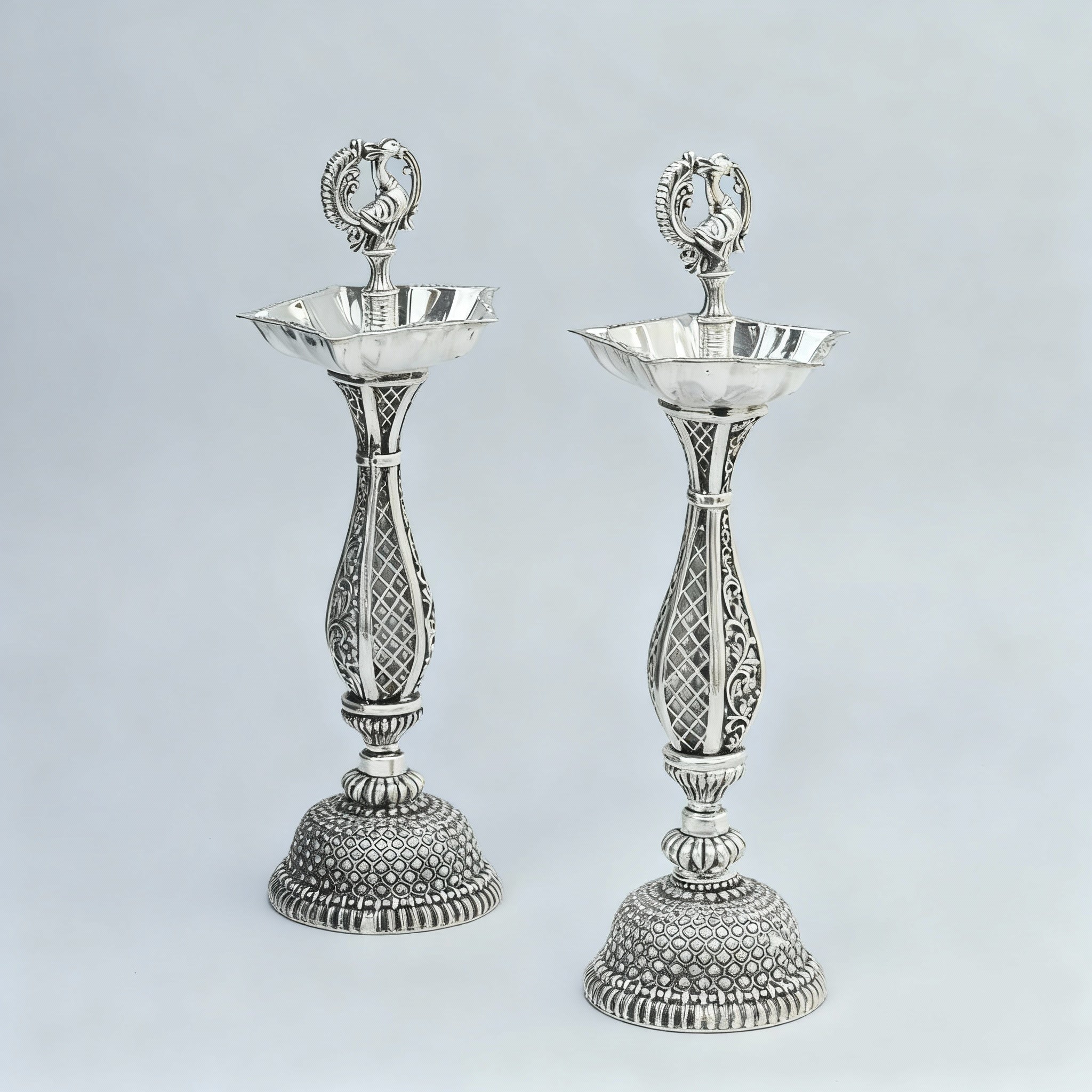 German Silver Peacock Diya Pair – Antique Finish Pooja Lamps for Temple & Auspicious Gifting, 9"