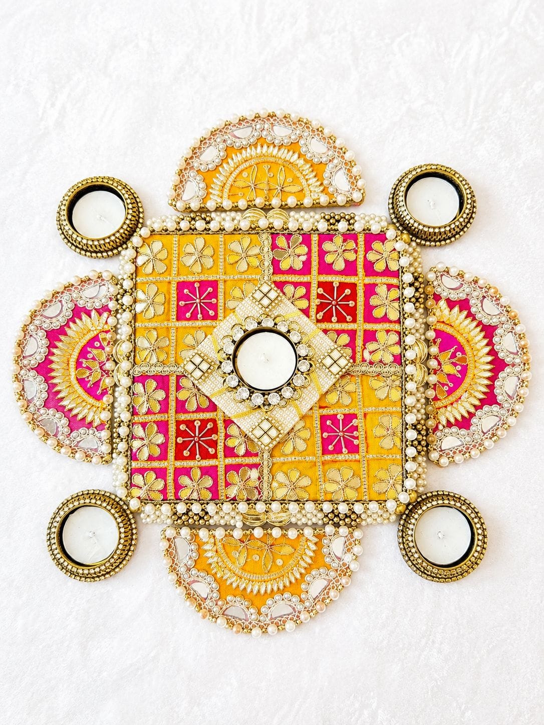 Set of 9 gota patti work rangoli mat set with MDF base and metal tea light holders including 1 center piece (7x7 inches), 4 semi-circle side pieces (5x2.5 inches), and 4 metal diyas for Diwali floor decor.