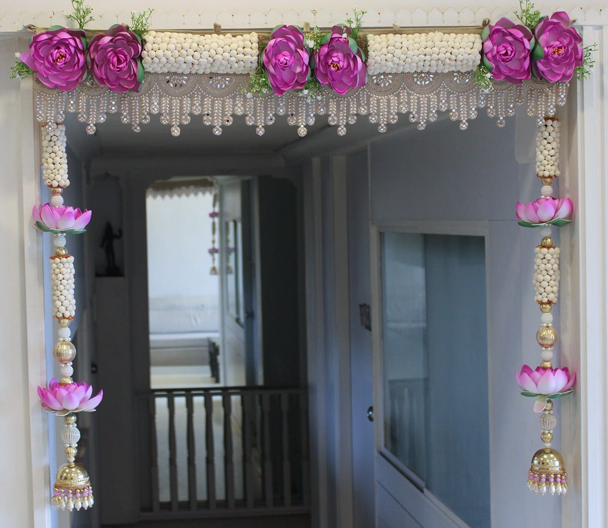 39-inch purple lotus main door toran set with two 34-inch side wall hangings made with beads and artificial flowers for Diwali and housewarming decor.