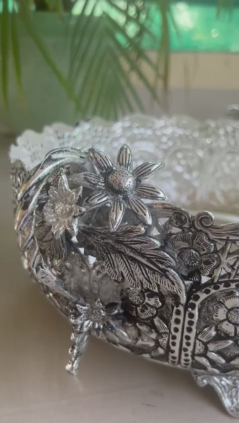 German silver fully carved round designer urli/basket with flower handles