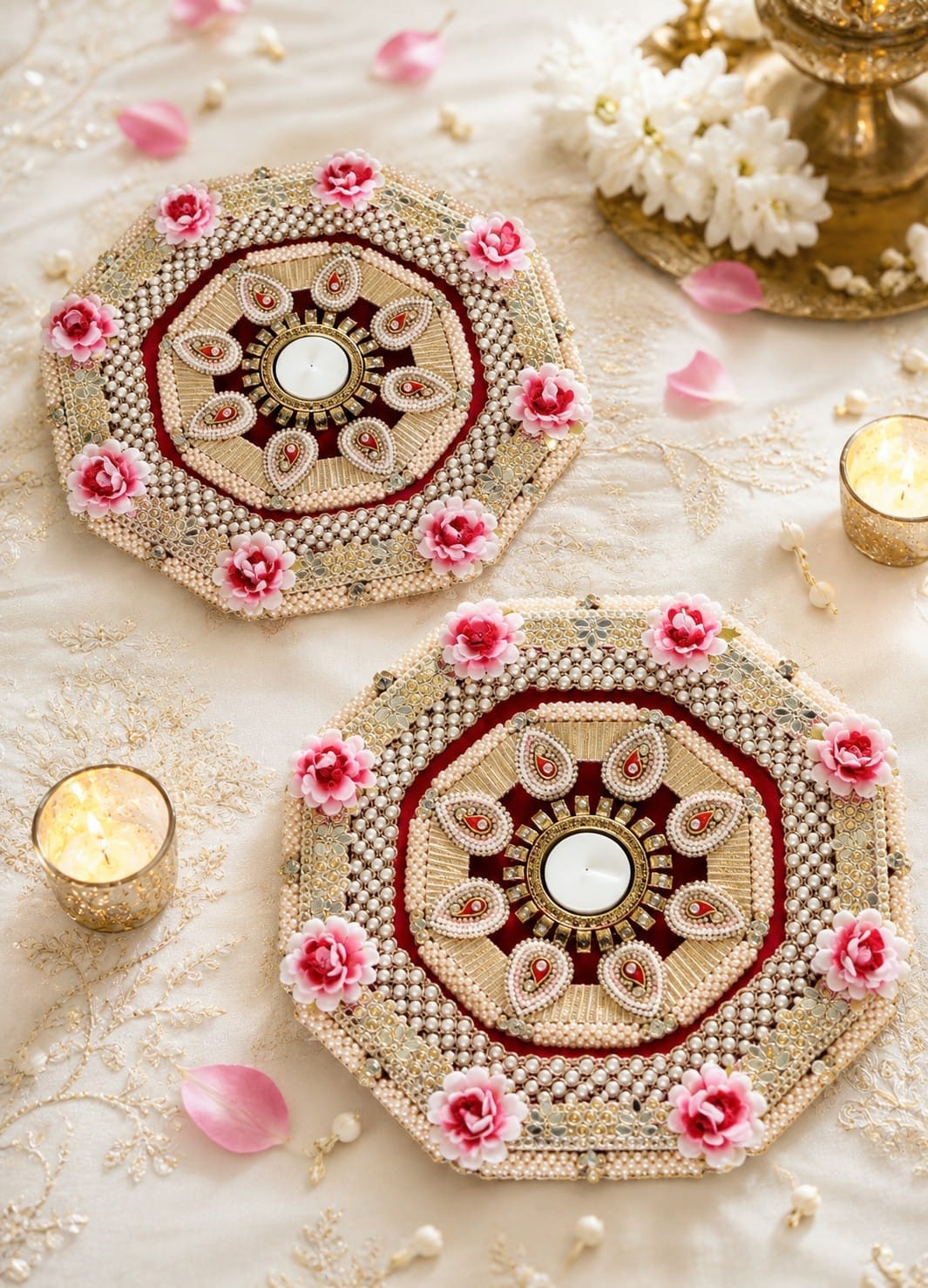 Set of 2 12x12-inch pink hexagonal MDF rangoli tea light holder mats decorated with pearls, stones, and artificial flowers for Diwali and housewarming decor.