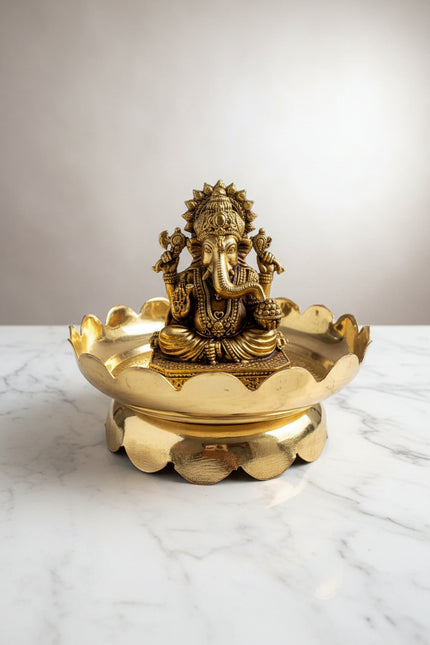 Handcrafted brass Lord Ganesha idol seated on a decorative lotus stand, ideal for pooja rooms, home temples, Vastu décor, meditation spaces, and spiritual gifting. 🕉️🌸✨🙏