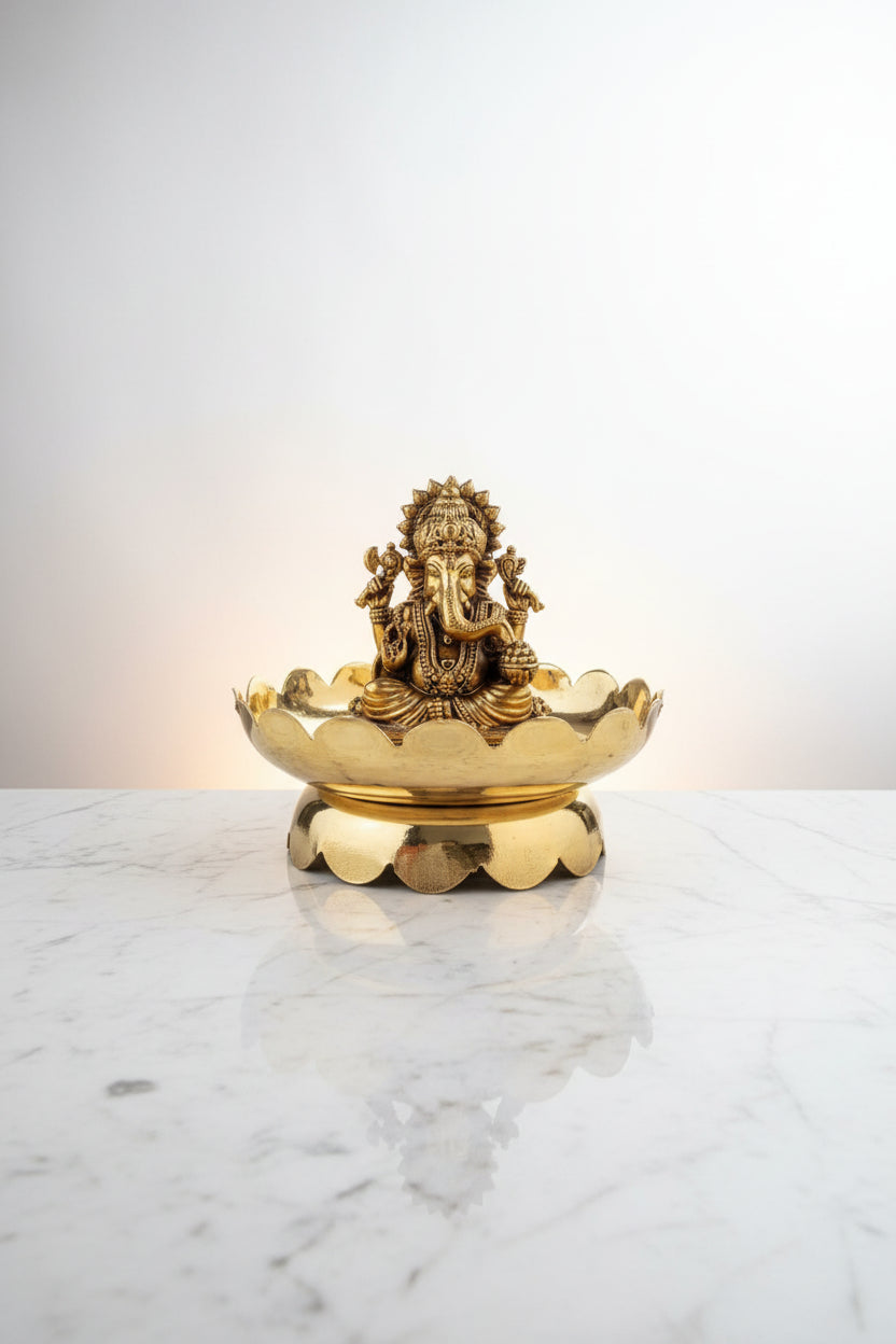 Handcrafted brass Lord Ganesha idol seated on a decorative lotus stand, ideal for pooja rooms, home temples, Vastu décor, meditation spaces, and spiritual gifting. 🕉️🌸✨🙏