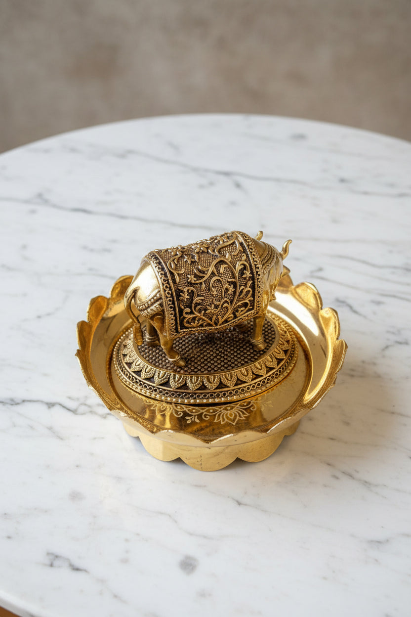 Handcrafted brass Kamdhenu cow and calf statue on a decorative lotus stand, ideal for pooja rooms, home temples, Vastu décor, spiritual spaces, and religious gifting. 🐄🌸✨🙏