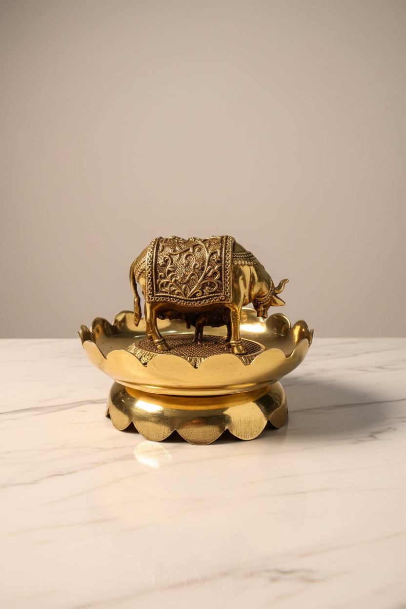 Handcrafted brass Kamdhenu cow and calf statue on a decorative lotus stand, ideal for pooja rooms, home temples, Vastu décor, spiritual spaces, and religious gifting. 🐄🌸✨🙏