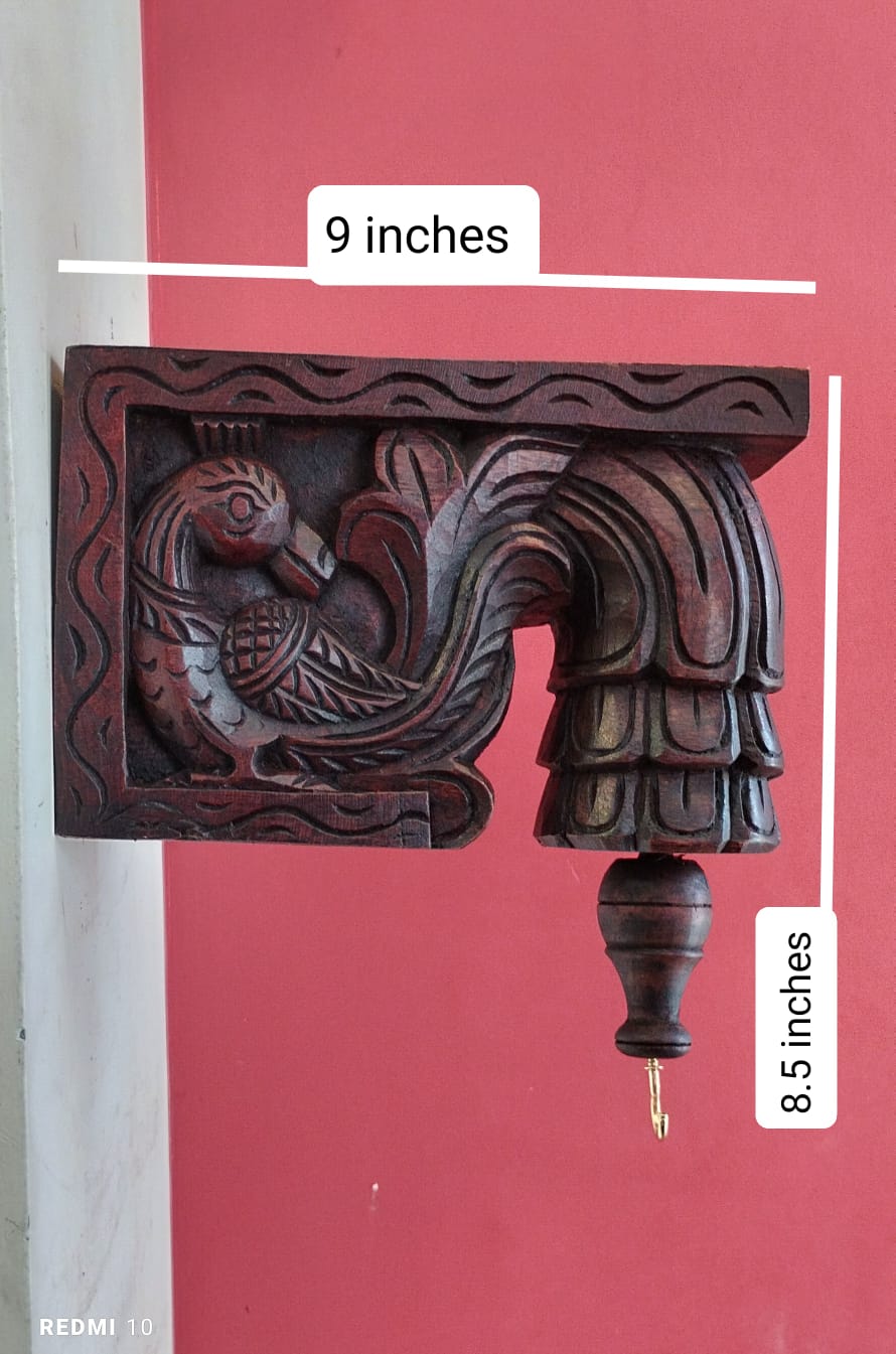 Handcrafted and hand painted wooden parrot wall bracket featuring colorful traditional Indian artwork for home décor and heritage-inspired interiors.